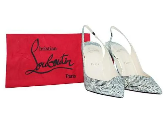 Christian Louboutin Tacones destalonados en relieve de piel de serpiente 